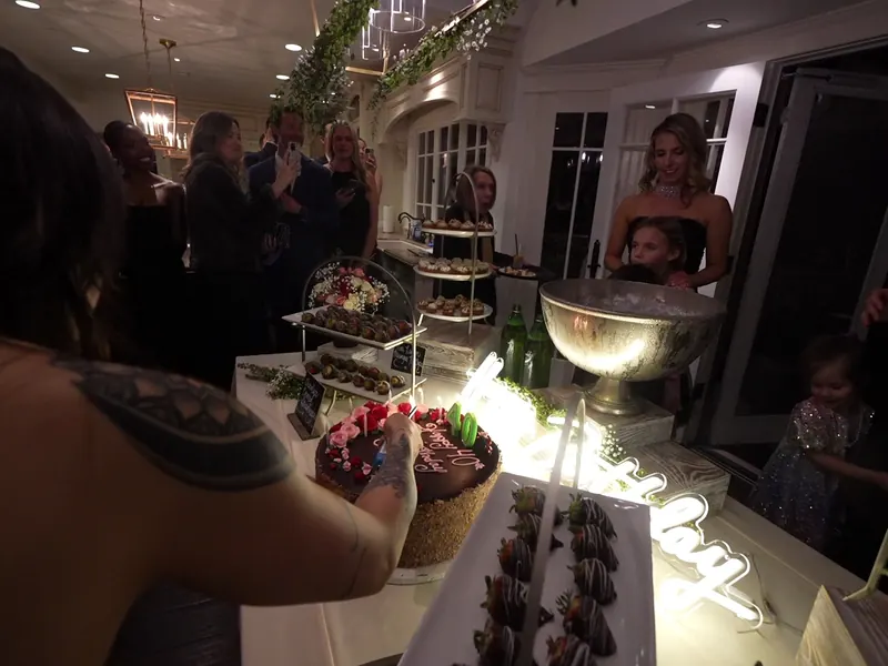 Server carrying a tray of passed appetizers at an evening reception