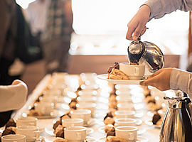 Waitress serving coffee in corporate catering silicon valley